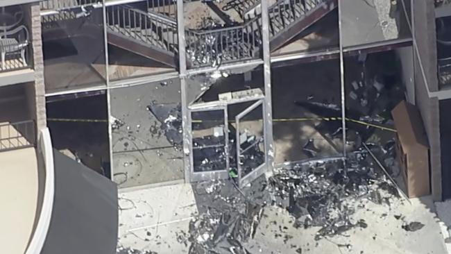 Debris covers the ground near the site of an explosion on Saturday, May 17, 2025 in Palm Springs, Calif. (ABC7 Los Angeles via AP)