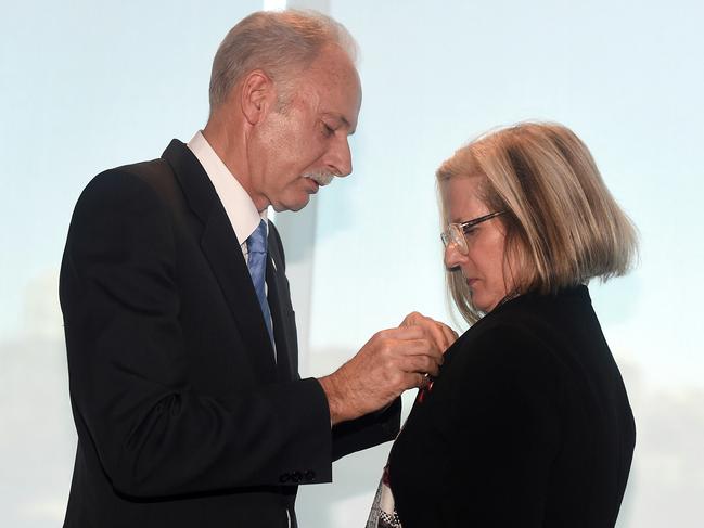 German Ambassador to Australia Dr Christoph Mueller presents Lucy Turnbull with her award. Picture: AAP Image/Lukas Coch.