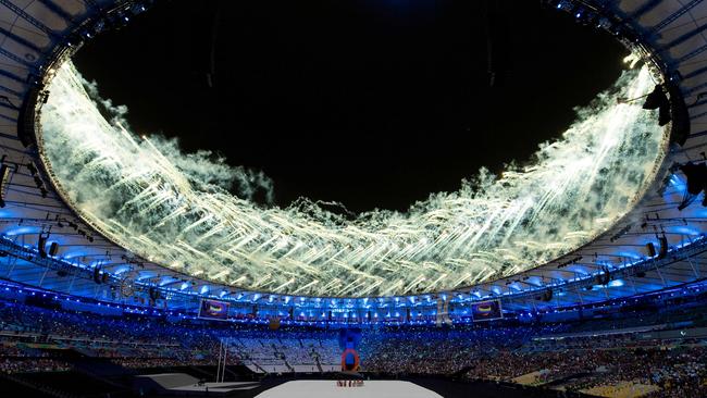 Fireworks around the roof of the Maracana Stadium light up the Rio night sky.