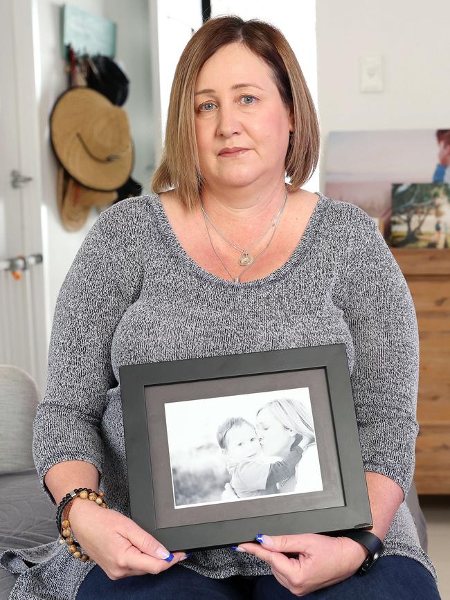 Mia Bannister at home with pictures of her late son Oliver Hughes. Picture: Liam Kidston