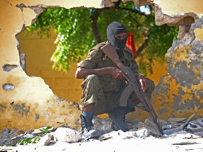 Somalia remains one of the poorest nations in the world after defaulting on their IMF loan in 1987. The country is also one of the world’s most dangerous. Here, a Somali soldier stands guard next to the site where Al Shebab militants carried out a suicide attack in Mogadishu on June 21, 2015.