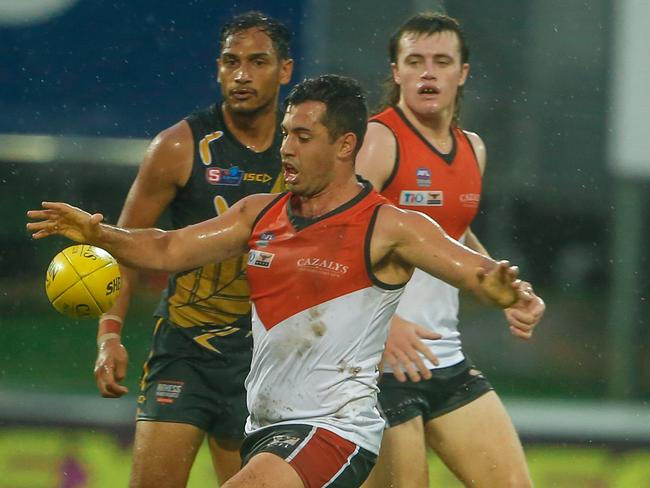 The NTFL Buffaloes’ Nathaniel Paredes gets the ball away against Glenelg at TIO Stadium on Saturday. Picture: Glenn Campbell