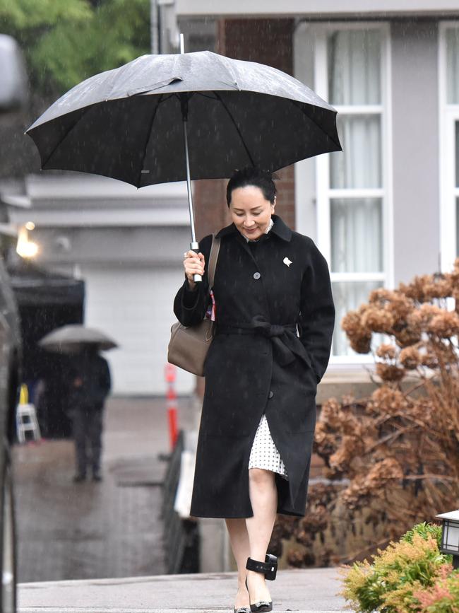 Huawei chief financial officer Meng Wanzhou leaves her Vancouver home with a Canadian government tracking device attached to her left ankle.