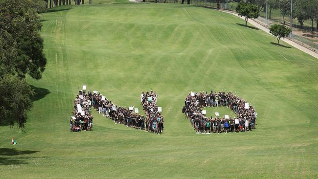 Victoria Park Olympic stadium protesters join forces to form giant human ‘NO’. Picture: Liam Kidston