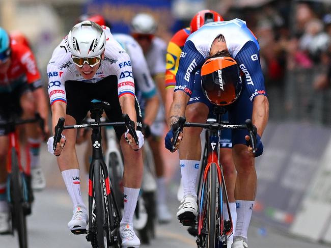 SANREMO, ITALY - MARCH 16: Jasper Philipsen of Belgium and Team Alpecin - Deceuninck crosses the finish line as race winner (R) ahead of Tadej Pogacar of Slovenia and UAE Team Emirates (L), Michael Matthews of Australia and Team Jayco AlUla (C) during the 115th Milano-Sanremo 2024 a 288km, one day race from Pavia to Sanremo / #UCIWT / on March 16, 2024 in Sanremo, Italy. (Photo by Dario Belingheri/Getty Images)