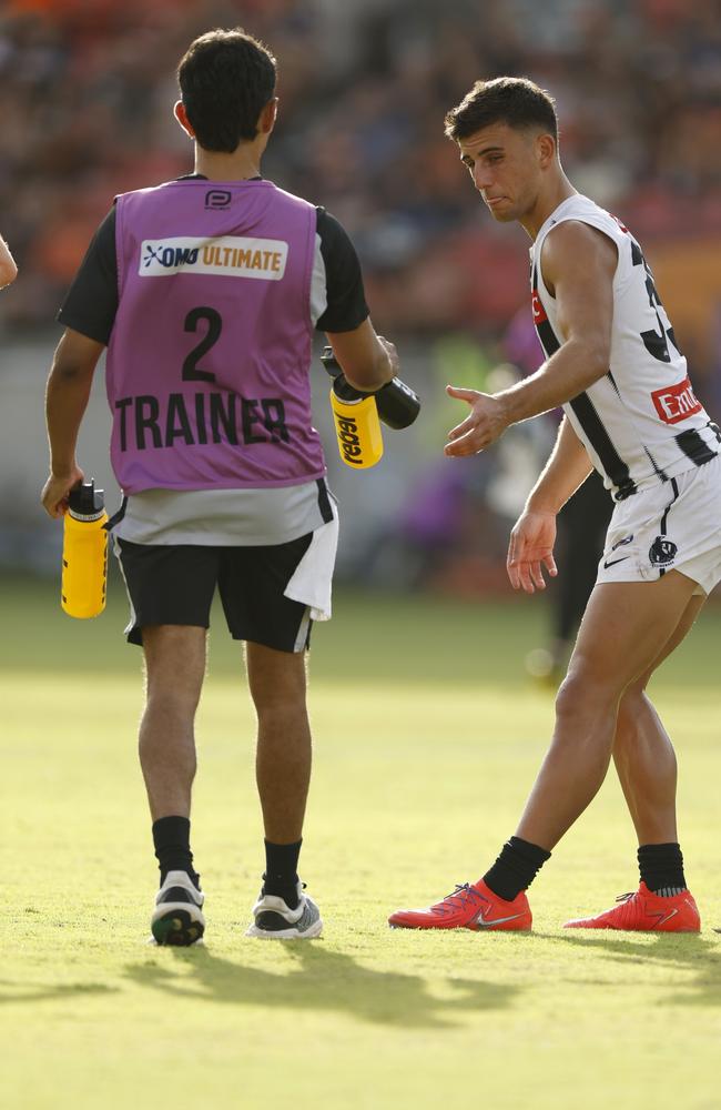 Nick Daicos deals with cramp. Picture: Darrian Traynor/Getty Images.