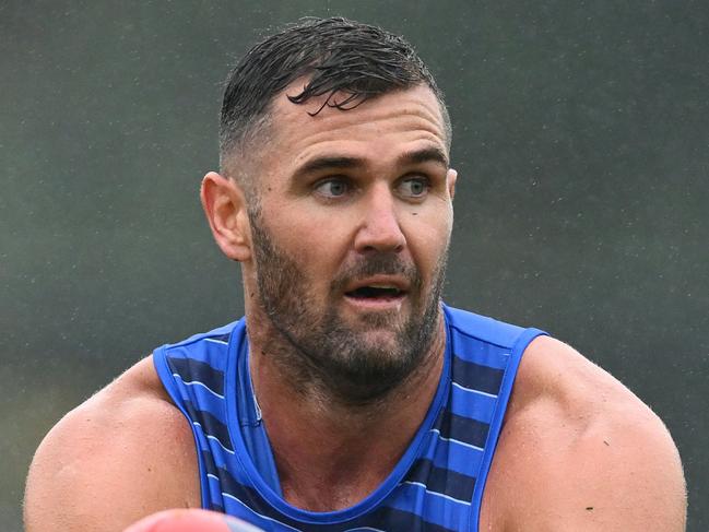 MELBOURNE, AUSTRALIA - NOVEMBER 25: Jack Darling of the Kangaroos handballs  during a North Melbourne Kangaroos AFL training session at Arden Street Ground on November 25, 2024 in Melbourne, Australia. (Photo by Quinn Rooney/Getty Images)