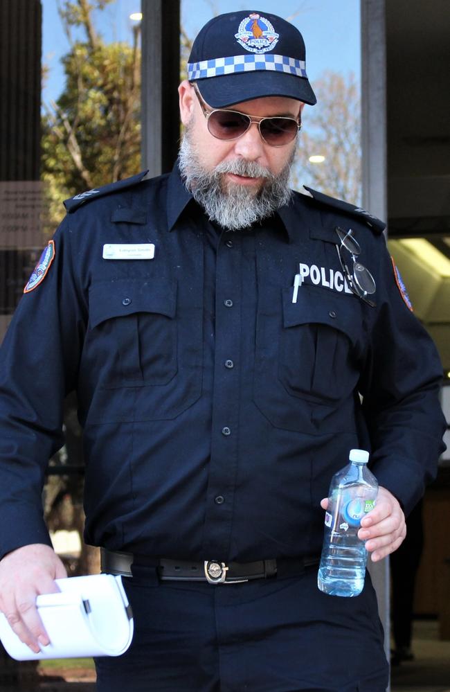 Remote Sergeant Lanyon Smith leaves the Alice Springs Local Court after giving evidence on Friday.