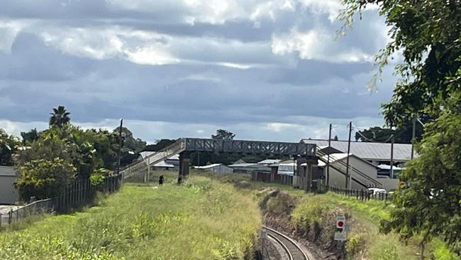 A man has died after his car went through a fence, down an embankment and onto railway tracks at Maryborough.