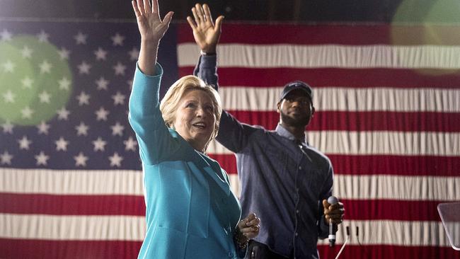 Democratic presidential candidate Hillary Clinton, left, accompanied by LeBron James.