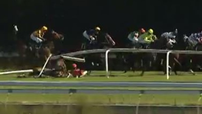 Jess Taylor hits the turf after So Blessed crashed through the running rail at Gosford on Thursday.