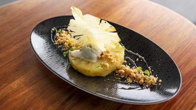 The roasted pineapple with macadamia nut crumble at Mica Brasserie in Newstead. Picture: Mark Cranitch