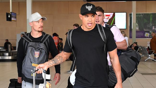 Dane Gagai, Damien Cook and Angus Crichton arrive at Gold Coast Airport. Picture: AAP