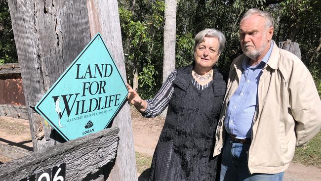 Chambers Flat Rd residents Harriet and Kenneth Aitken at their front gate which is part of the land the council will resume. PHOTO: JUDITH KERR