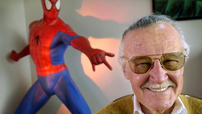 Stan Lee with one of his most famous creations, Spider-Man. Picture: AP Photo/Reed Saxon, File