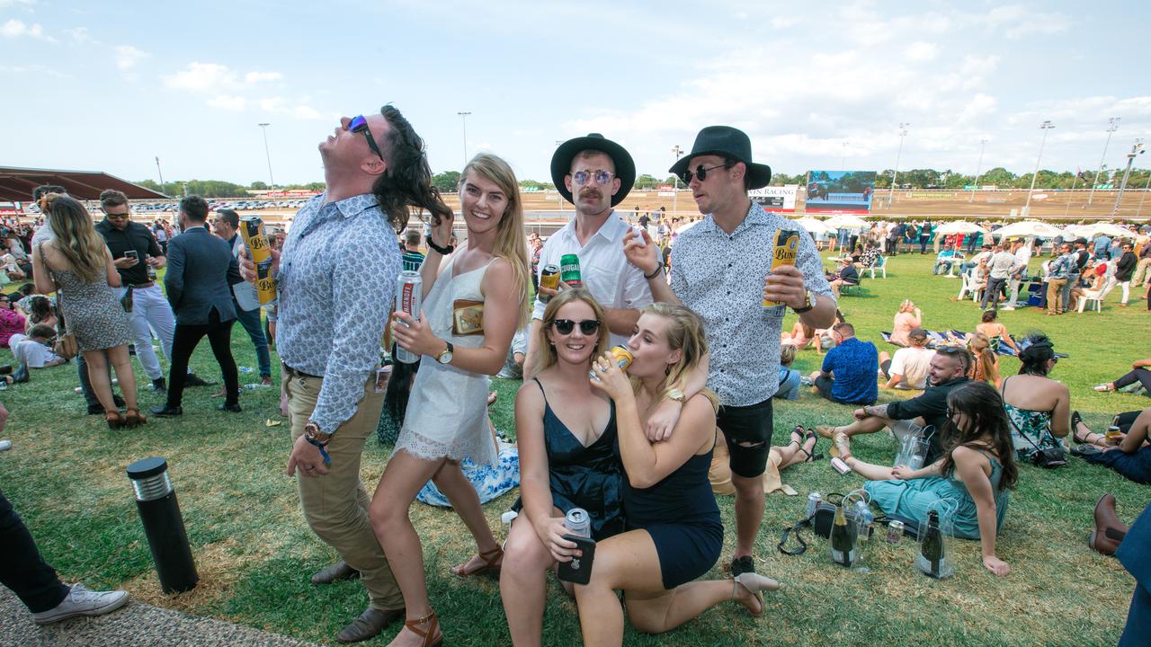 Joel Mortlock, Hayley Sansom, Phillip Finch, Thomas Tancocl , Maddie Crumblin and Nikkie Milgate on ground as punters enjoy the Great Northern Darwin Cup. Picture: GLENN CAMPBELL