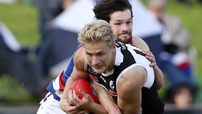 Billy Frampton marks in front of Ryan Llewellyn in the SANFL. Picture SARAH REED