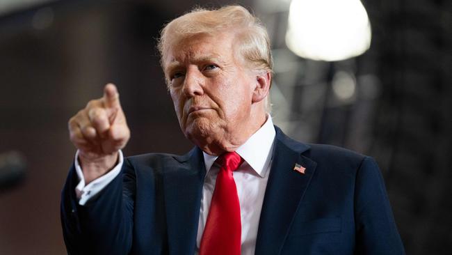 Donald Trump arrives on stage at Herb Brooks National Hockey Centre in St Cloud, Minnesota on Saturday. Picture: Getty Images