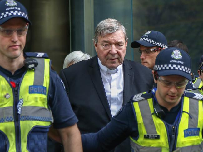 FILE - In this May 2, 2018, file photo, Cardinal George Pell, the most senior Catholic cleric to face sex charges, leaves court in Melbourne, Australia. Pell was sentenced in an Australian court on Wednesday, March 13, 2019 to 6 years in prison for molesting two choirboys in a Melbourne cathedral more than 20 years ago.  (AP Photo/Asanka Brendon Ratnayake, File)