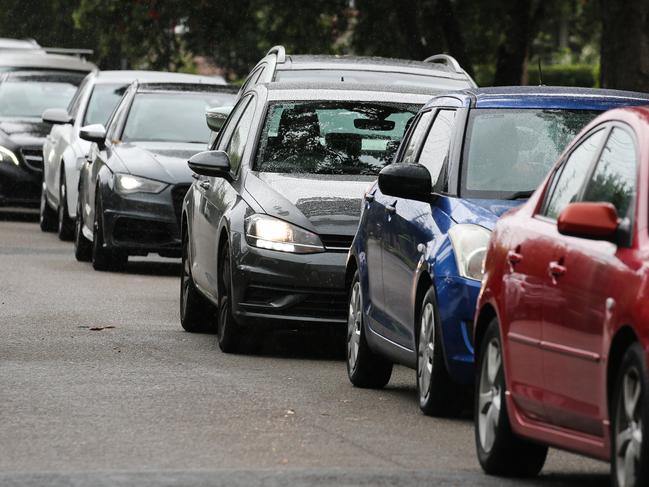 SYDNEY, AUSTRALIA - NewsWire Photos, DECEMBER 23 2021: Peopole are seen queuing in their cars at the Haberfield Drive through Covid-19  testing clinic as testing demand surges ahead of the holidays in Sydney. Picture: NCA NewsWire / Gaye Gerard