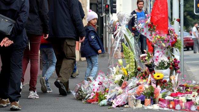 Flowers form a makeshift memorial to Sarah Paino at the scene of the crash on Davey St. Picture: JAY TOWN