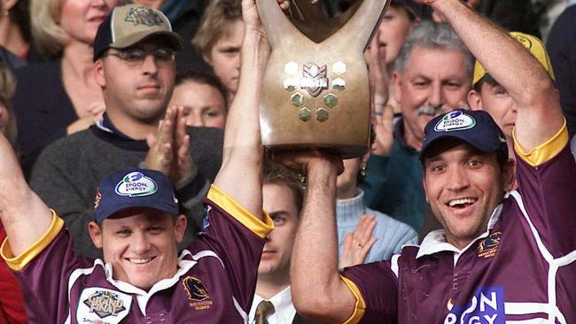 AUGUST 27, 2000: Captain Kevin Walters (L) &amp; Gorden Tallis lift trophy aloft at presentation after Brisbane defeated Sydney Roosters NRL Grand Final at Stadium Australia, Homebush, 27/08/00. Pic Phil Hillyard. Rugby League