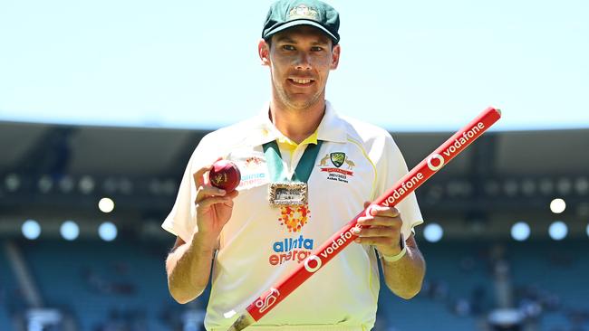 Scott Boland poses with the Johnny Muller medal, match ball and stump after winning the Ashes. Picture: Getty Images