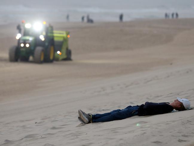 A Schoolie sleeping off the previous night’s festivities. Picture:/Richard Gosling