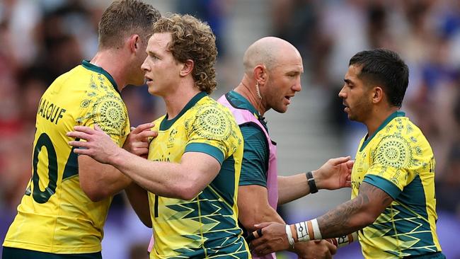 PARIS, FRANCE - JULY 24: Nick Malouf #10 of Team Australia and Henry Hutchison #1 of Team Australia celebrate following victory during the Men's Rugby Sevens Pool B Group match between Australia and Kenya on Day -2 of the Olympic Games Paris 2024 at Stade de France on July 24, 2024 in Paris, France. (Photo by Cameron Spencer/Getty Images)