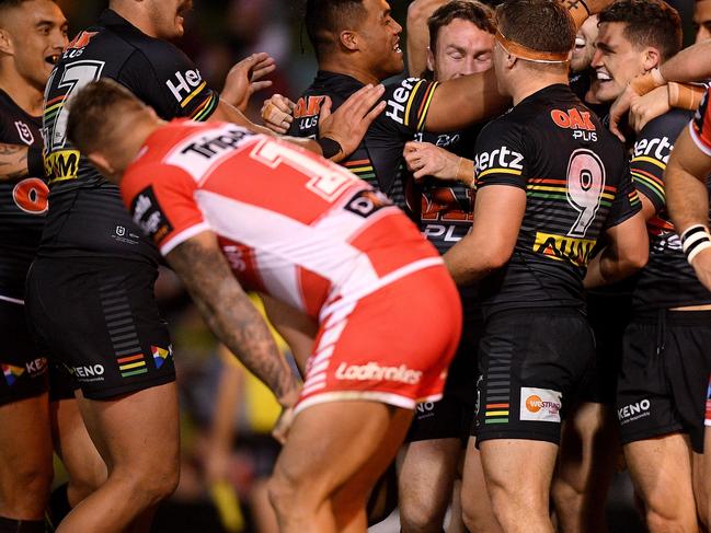 Nathan Cleary of the Panthers (second right) celebrates with teammates after scoring a try during the Round 18 NRL match between the Penrith Panthers and the St George Illawarra Dragons at Panthers Stadium in Sydney, Friday, July 19, 2019. (AAP Image/Dan Himbrechts) NO ARCHIVING, EDITORIAL USE ONLY