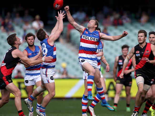 Paul Thomas and Jarrod Schiller go up for the ball. Photo: Simon Cross.