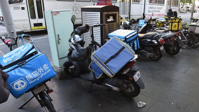 Multiple delivery bikes cluttering the footpath. Picture: Tony Gough