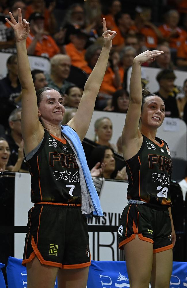 Courtney Woods and Abbey Ellis of the Fire celebrate after a basket during the round 15 WNBL match between Townsville Fire and Perth Lynx at Townsville Entertainment Centre, on February 16, 2025, in Townsville, Australia. (Photo by Ian Hitchcock/Getty Images)