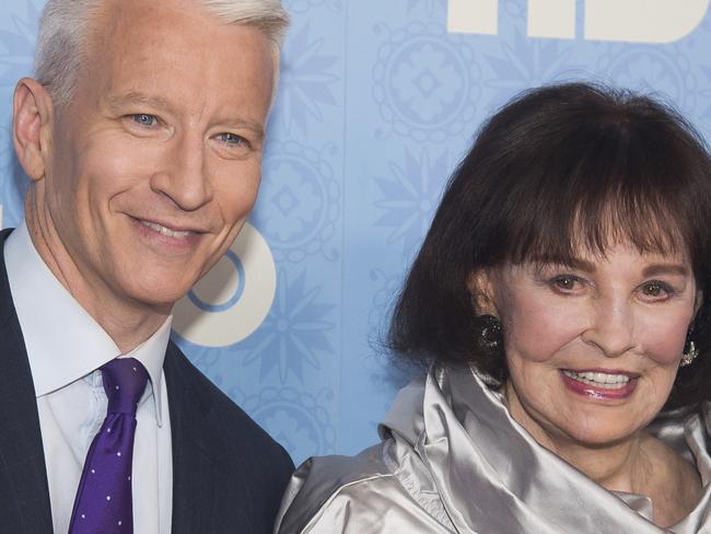 FILE - In this April 4, 2016 file photo, CNN anchor Anderson Cooper and Gloria Vanderbilt attend the premiere of "Nothing Left Unsaid" at the Time Warner Center in New York. Vanderbilt, the "poor little rich girl" heiress at the center of a scandalous custody battle of the 1930s and the designer jeans queen of the 1970s and '80s, died on Monday, June 17, 2019, at 95, according to her son, Cooper. (Photo by Charles Sykes/Invision/AP, File)