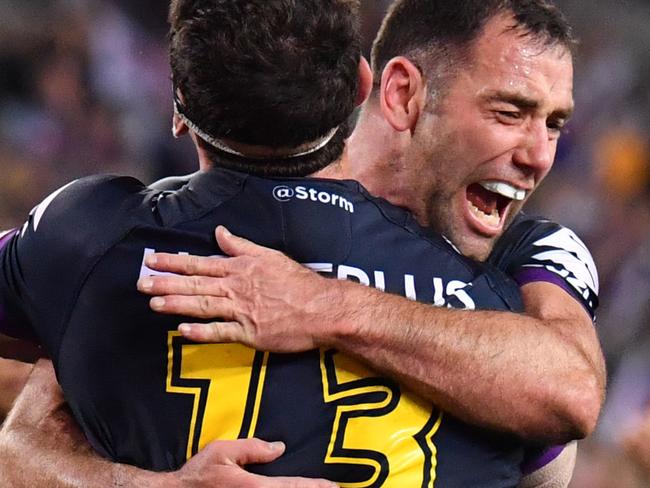 Dale Finucane and Cameron Smith of the Storm celebrate after Finucane scores a try during the NRL grand final between the Melbourne Storm and the North Queensland Cowboys at ANZ Stadium in Sydney, Sunday, October 1, 2017. (AAP Image/Mick Tsikas) NO ARCHIVING, EDITORIAL USE ONLY