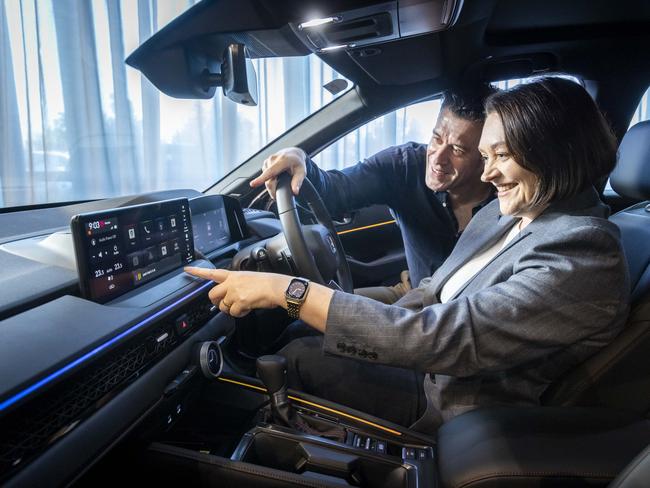 Honda Australia director Carolyn McMahon and Telstra industry executive Jon Young Flores inside the new Honda Accord. Picture: Wayne Taylor.