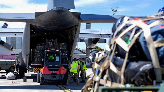 A Royal New Zealand Air Force C-130H transport aircraft being loaded with humanitarian assistance and disaster relief supplies at RNZAF Base Auckland. Picture: Maria Eves / NEW ZEALAND DEFENCE FORCE / AFP