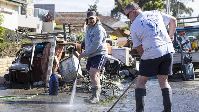 Maribyrnong residents begin the clean-up after recent flooding. Picture: NCA NewsWire / Aaron Francis