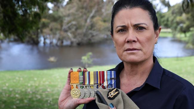 Leigh Locke-Thomas with Matt's medals and beret. Leigh is the widow of SAS soldier Matt Locke who died in Afghanistan in 2007. Pic Colin Murty