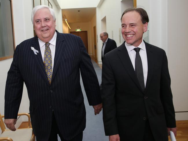 All smiles ... PUP leader Clive Palmer with Environment Minister Greg Hunt after their major climate policy deal was struck at Parliament House in Canberra. Picture: Gary Ramage.