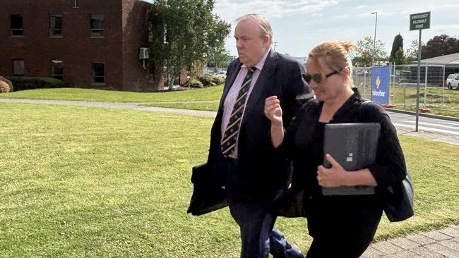 Rosemary Anne Gamble, flanked by a member of her legal team, enters Devonport Magistrates Court on Wednesday, November 6, ahead of Day 2 of the hearing into the deaths in December 2021 of six children at Hillcrest Primary School in a jumping castle incident. Picture: Simon McGuire