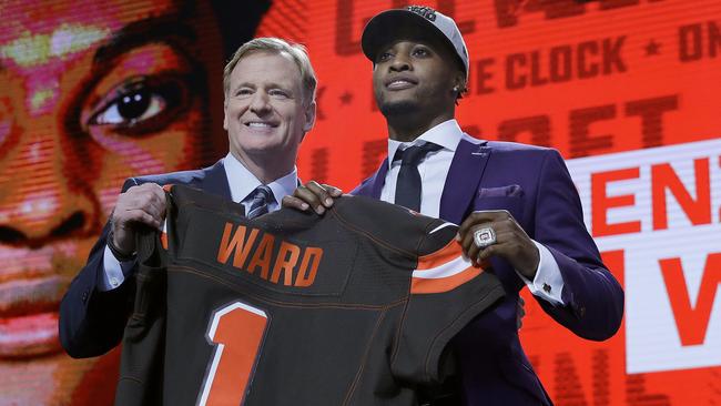 Ohio State's Denzel Ward, right, poses with Commissioner Roger Goodell after being selected by the Cleveland Browns. Picture: AP.