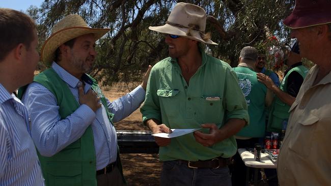 HA chairman Riad Qasim talks to farmers