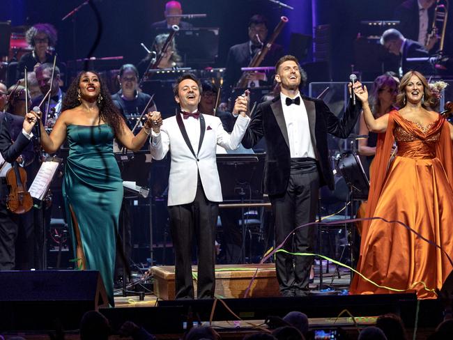 Josh Piterman, Paulini Curuenavuli, and Silvie Paladino taking a bow with conductor John Foreman after performing at NYE Gala at Hamer Hall. Picture: David Geraghty