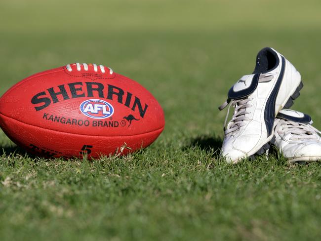 Generic AFL Sherrin football and football boots. sport /