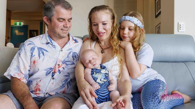 Dad Luke Waldrip, baby Spencer, mum Suvi Mahonen and Spencer’s sister Amity, 9, at their Gold Coast. Picture: Glenn Hunt