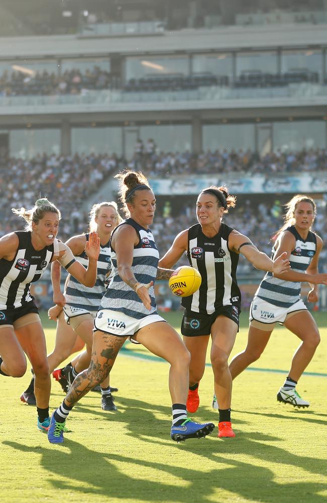 Mia-Rae Clifford wins the footy in front of a big home crowd.