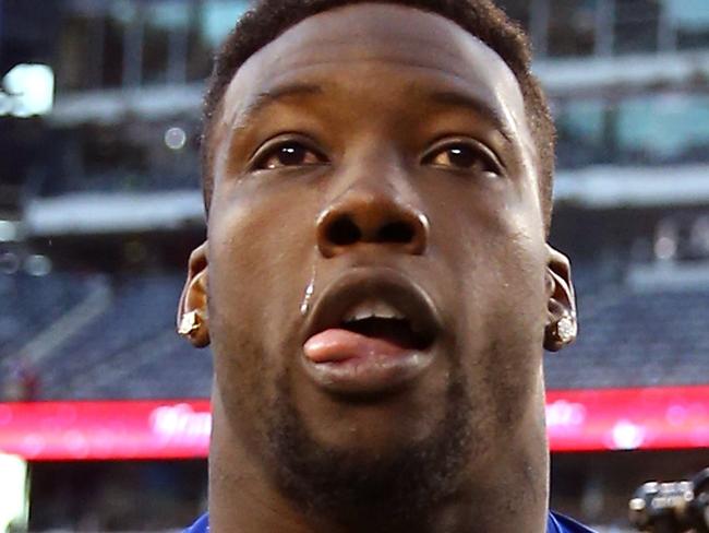 EAST RUTHERFORD, NJ - DECEMBER 14: Jason Pierre-Paul #90 of the New York Giants runs off the field after their game against the Washington Redskins at MetLife Stadium on December 14, 2014 in East Rutherford, New Jersey. The New York Giants defeated the Washington Redskins 24 to 13. (Photo by Al Bello/Getty Images)