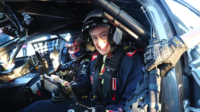 Cara Jenkin with Red Bull Holden Racing Team driver Jamie Whincup during a hot lap at The Bend. Picture: Tait Schmaal