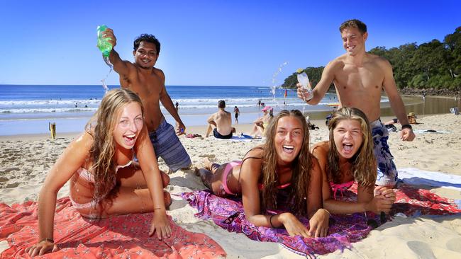 Backpackers at Noosa beach prior to the Covid-19 pandemic. Picture: Megan Slade.